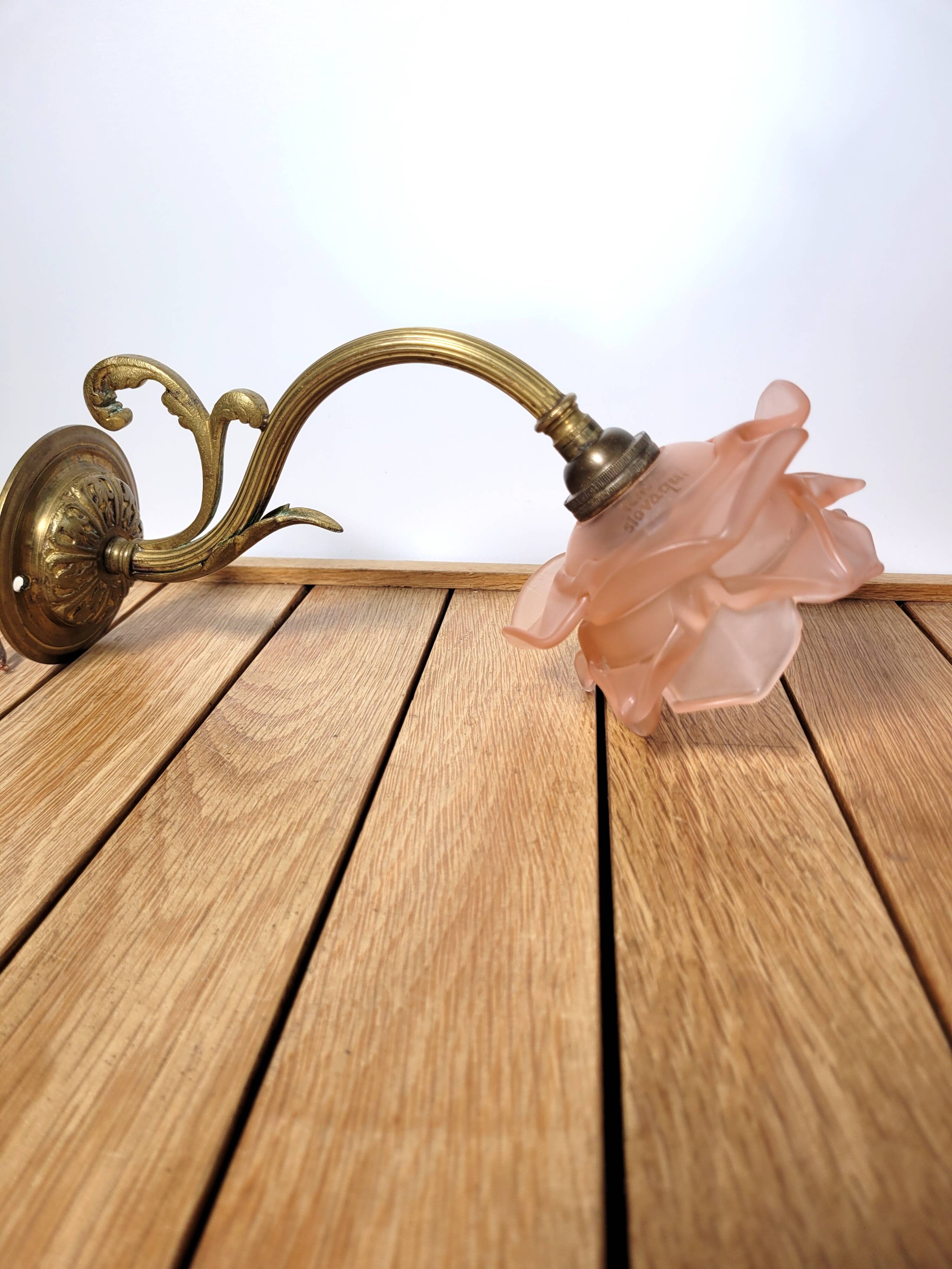 Old pink and golden brass wall lamp