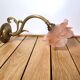 Old pink and golden brass wall lamp