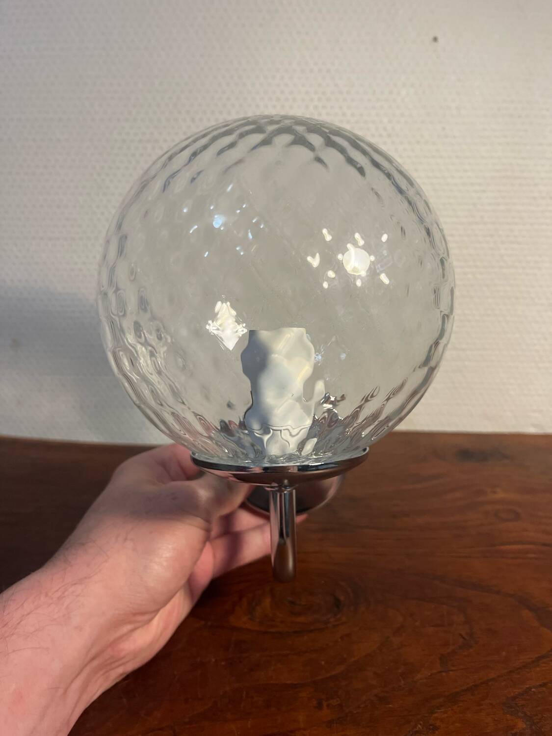 Delmas chrome wall light with chiseled glass globe