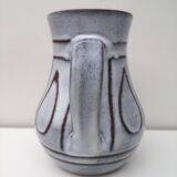 Vintage pitcher in enamelled earth