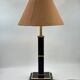 Vintage table lamp in black lacquer and gold metal, fluted column.