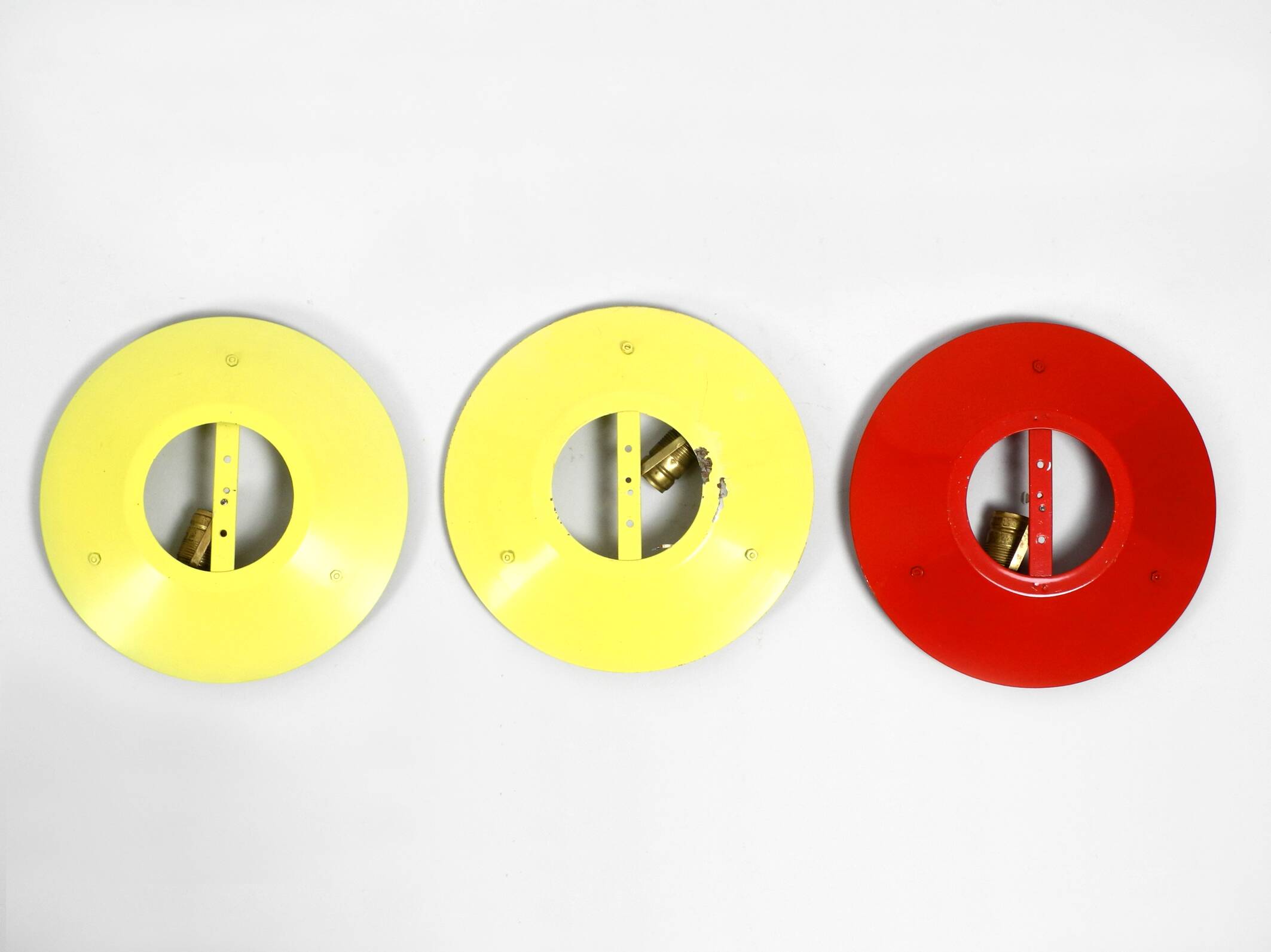 Three round 1950s wall or ceiling lamps made of metal and plexiglass shades