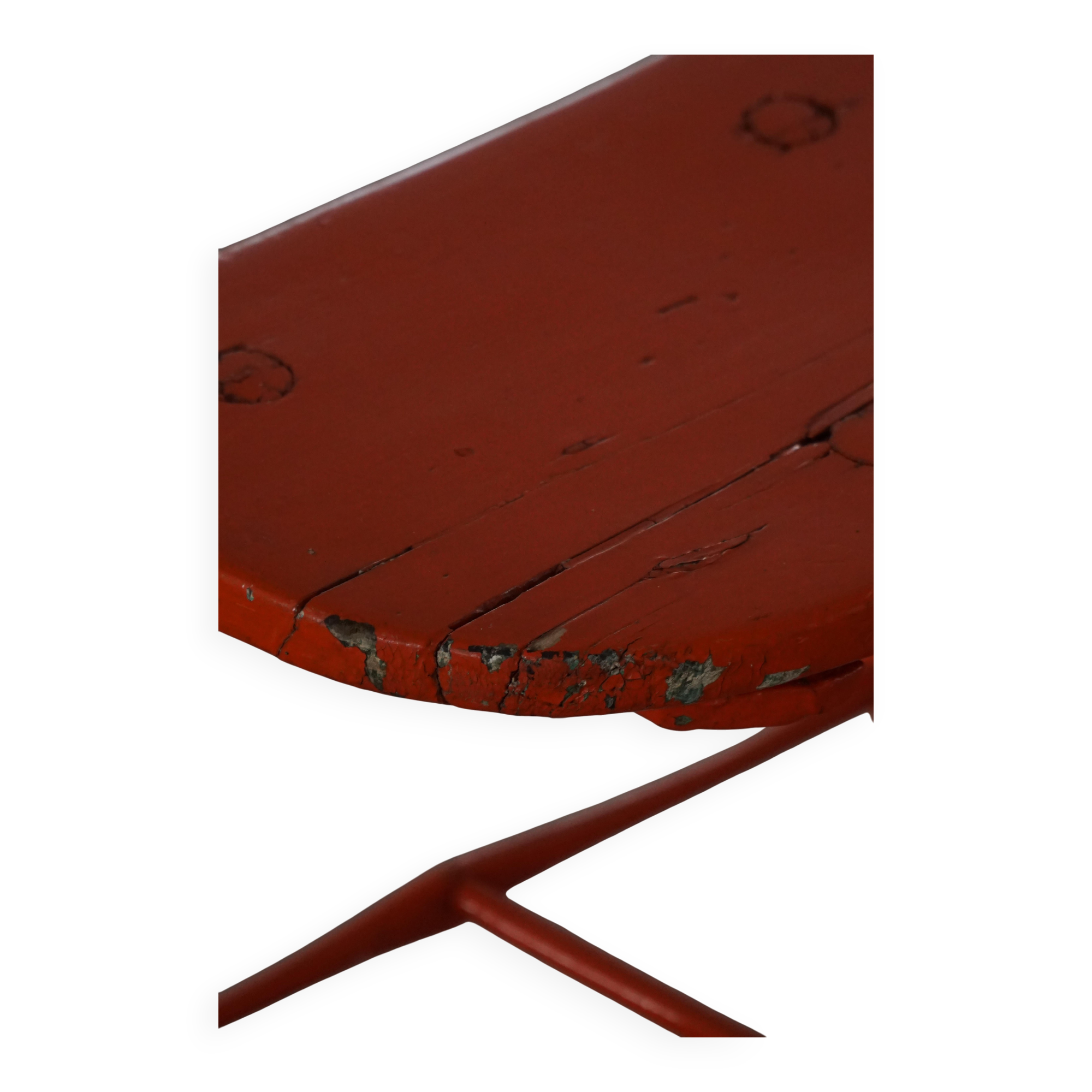 Pair of patinated wooden stools painted red with flared legs, 1950s-1960s.