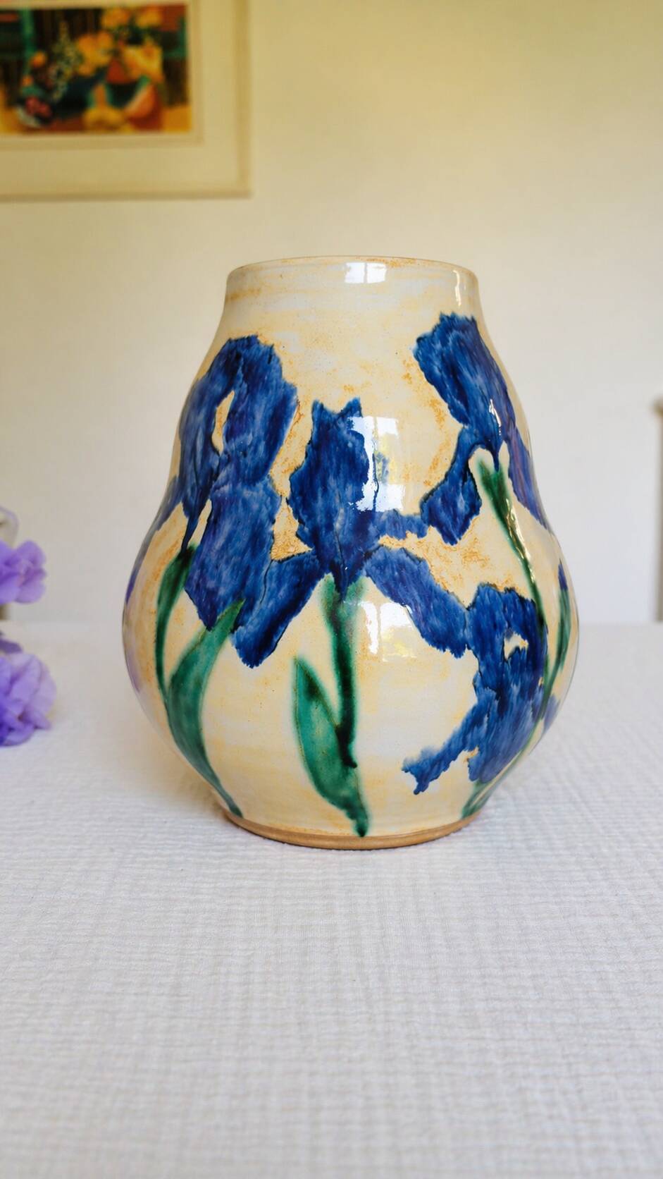 Hand-painted decorative vase with blue/purple irises.