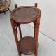Vintage folding wooden and wicker side table.