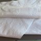 White embroidered organdie tablecloth and 12 assorted towels