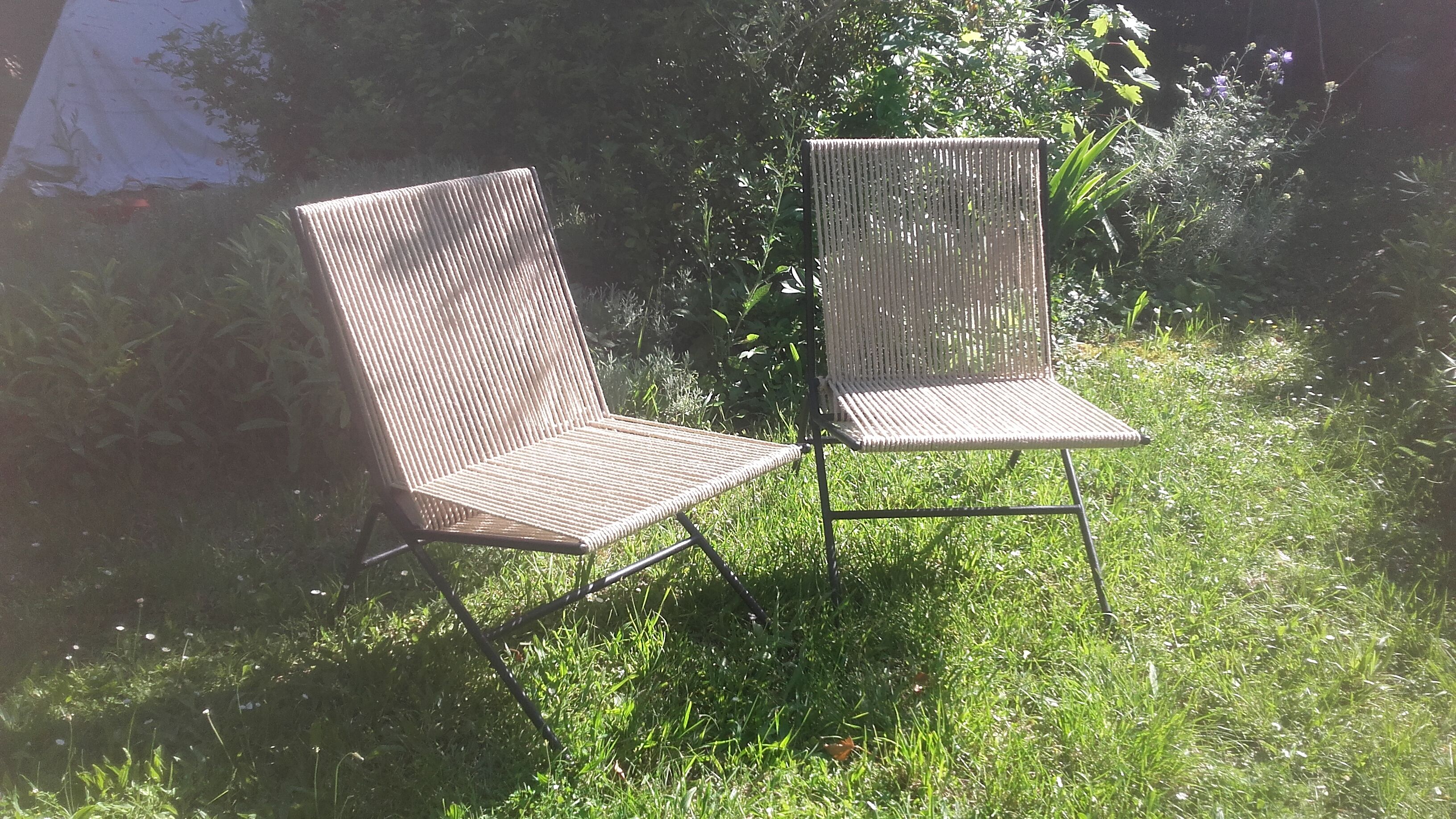 Seated metal and rope backs armchairs