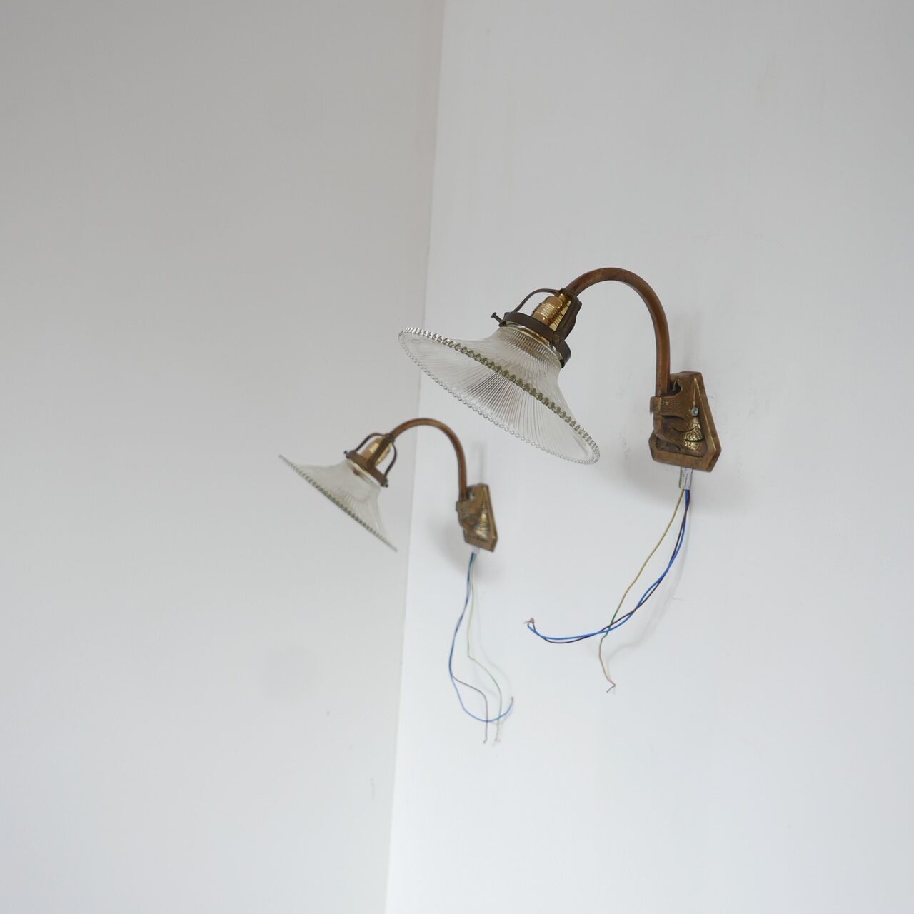 Pair of brass and glass wall sconces