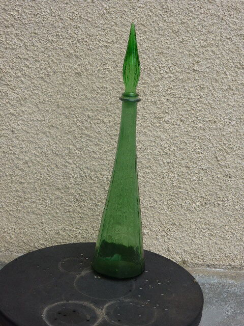 Vintage green faceted glass bottle with its cap 1970