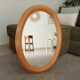 Vintage oval mirror in beech from the 70s/80s.