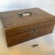 Old wooden box with handle and metal keys