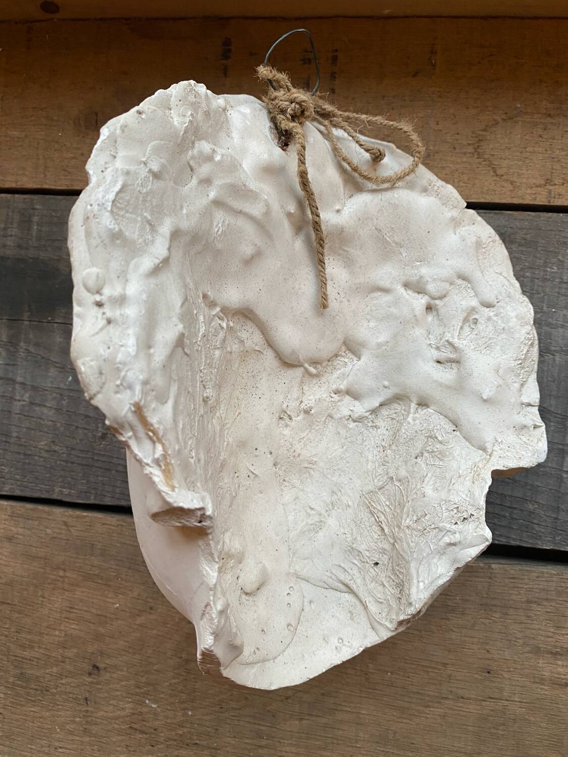 Plaster face wall statue