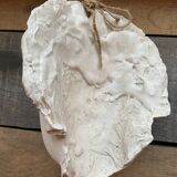 Plaster face wall statue