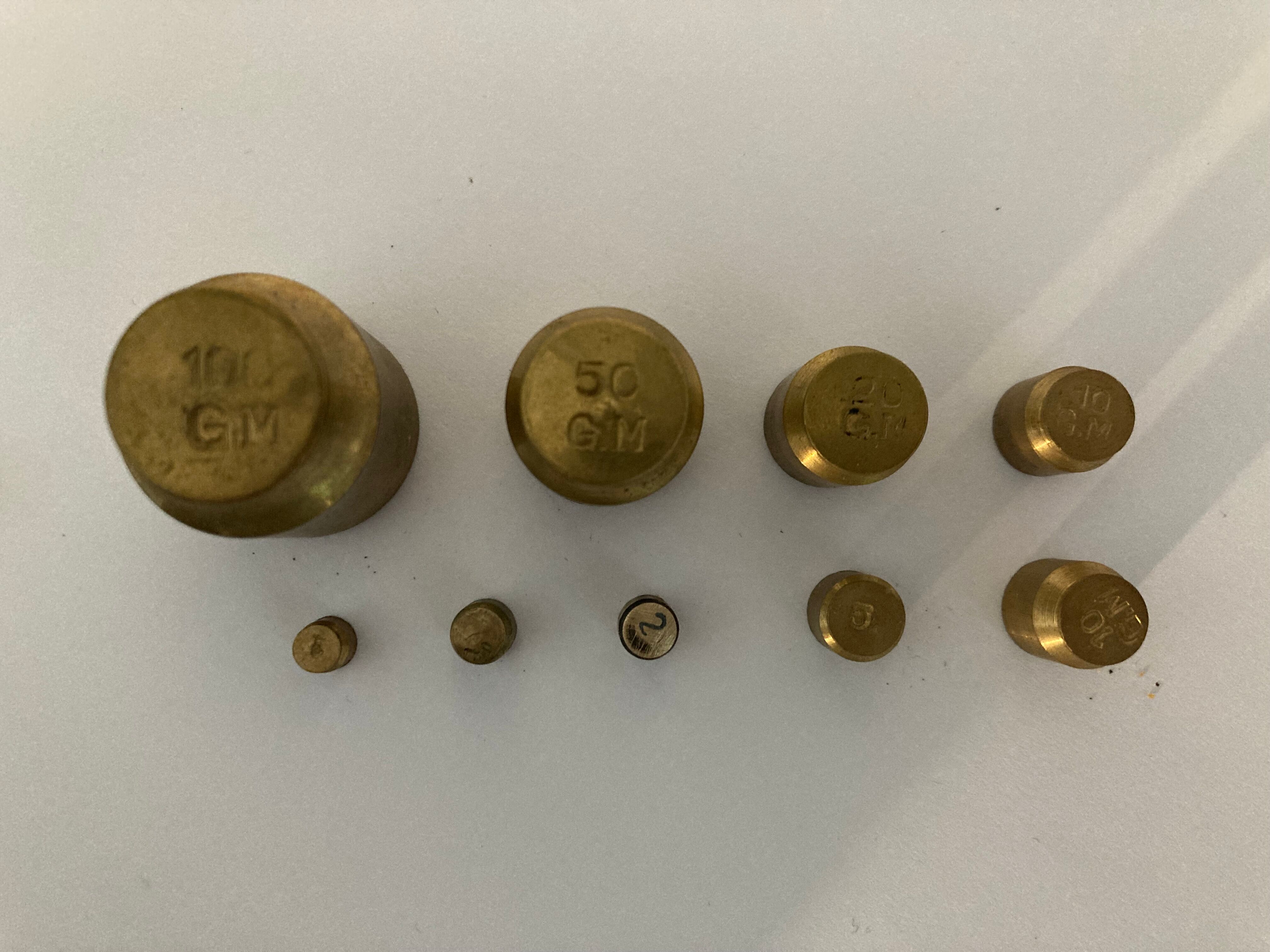 Balance weight in their wooden box