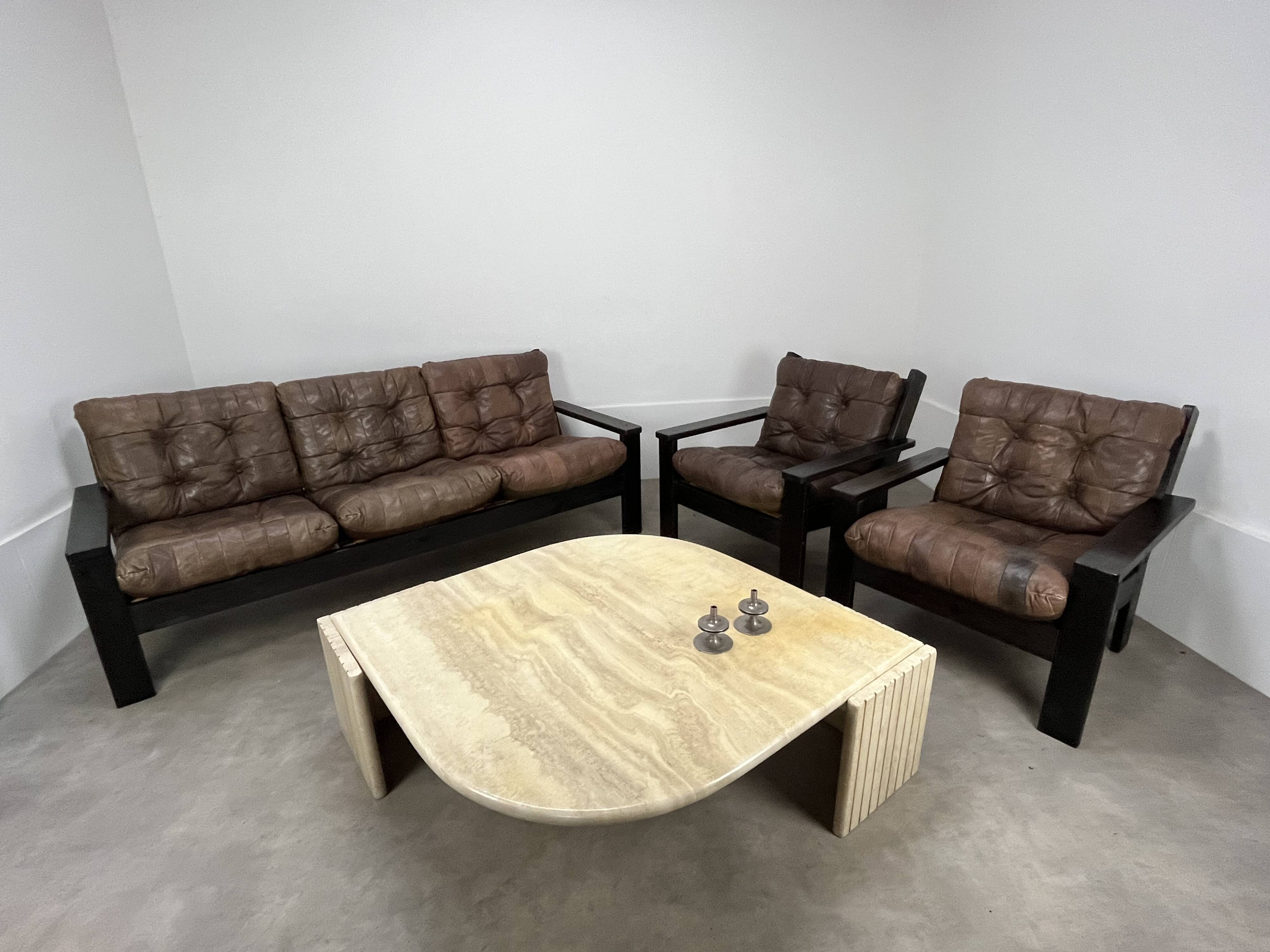 Living room sofa and brutalist armchairs in leather and wood, 70s, chalet style