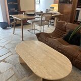 Oval coffee table in raw travertine