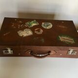 Suitcase of leather with labels of palaces