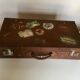 Suitcase of leather with labels of palaces