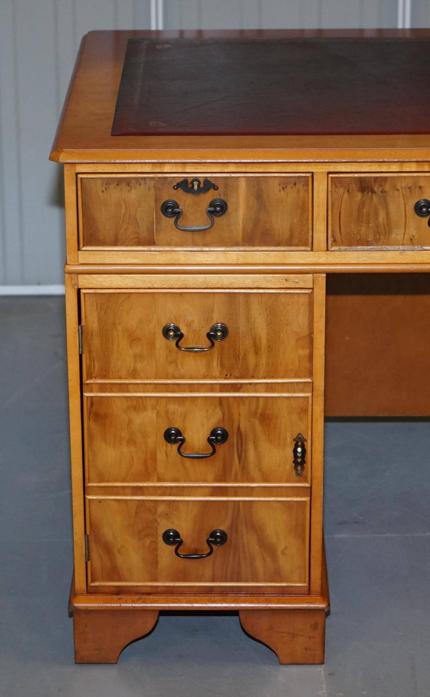 Vintage satin wood partner desk with leather top.