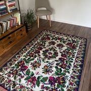White vintage floral rug made by hand in Romania, beautiful flowers
