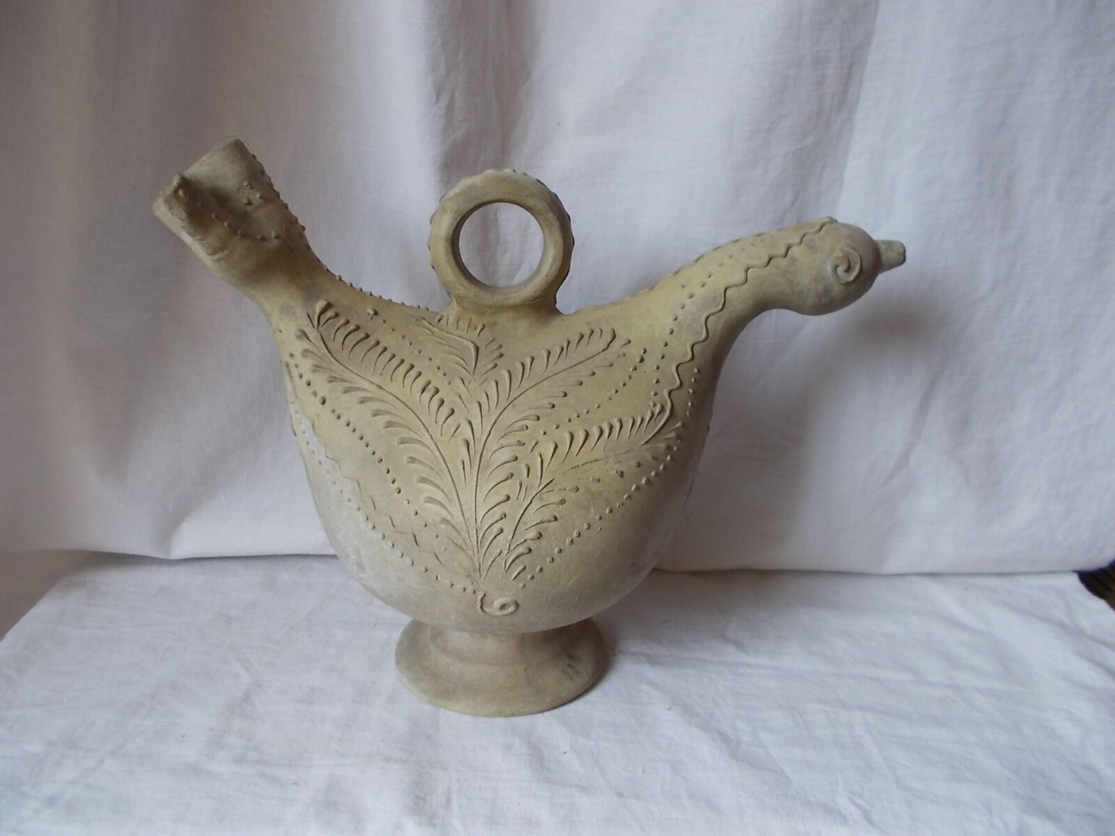 Old grey terracotta jug