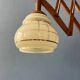 Vintage wall lamp with teak wood scissors and glass shade.