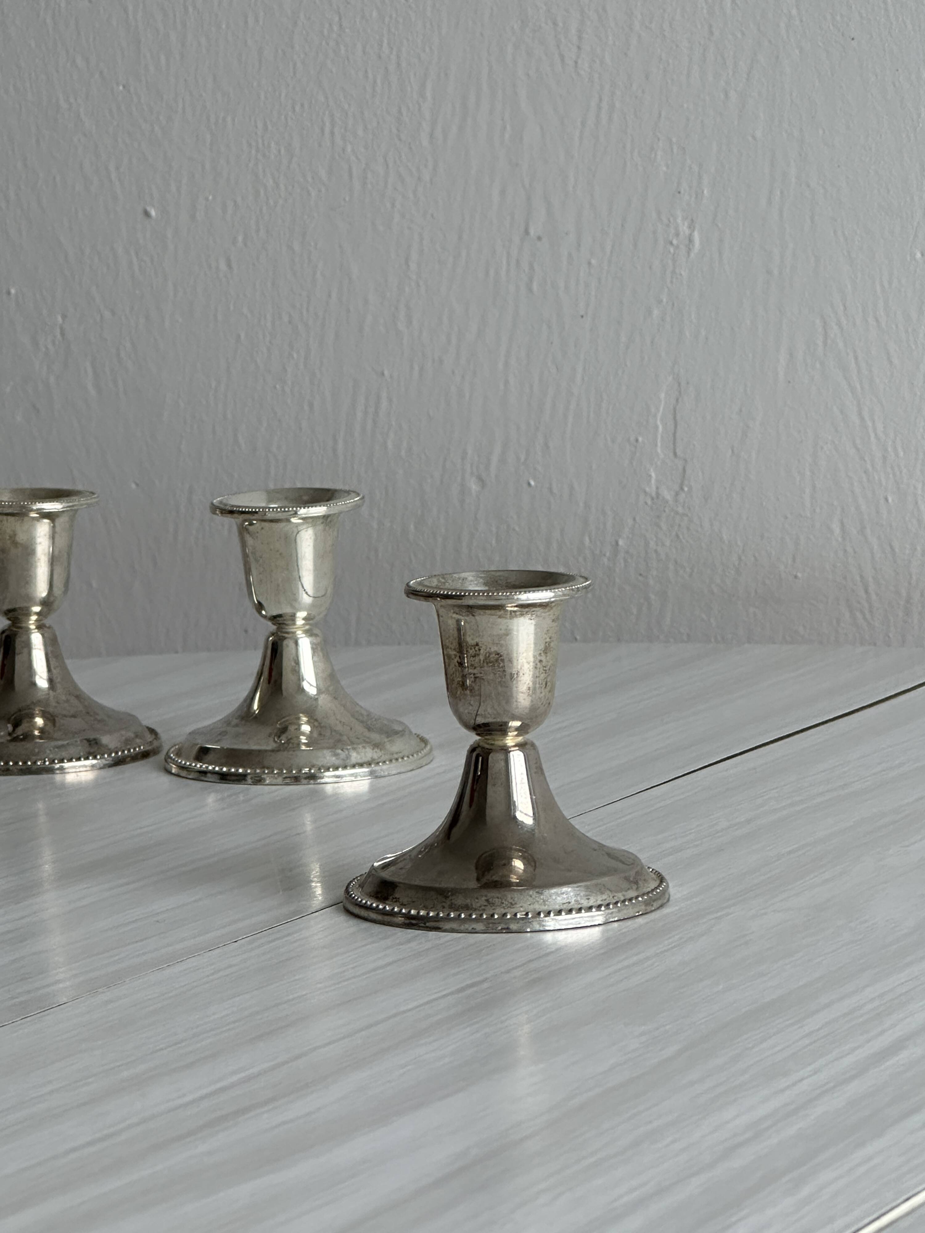 4 vintage metal candle holders