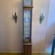 Walnut showcase, grooved uprights, 4 glass shelves