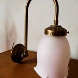 Brass wall lamp with pale pink bell