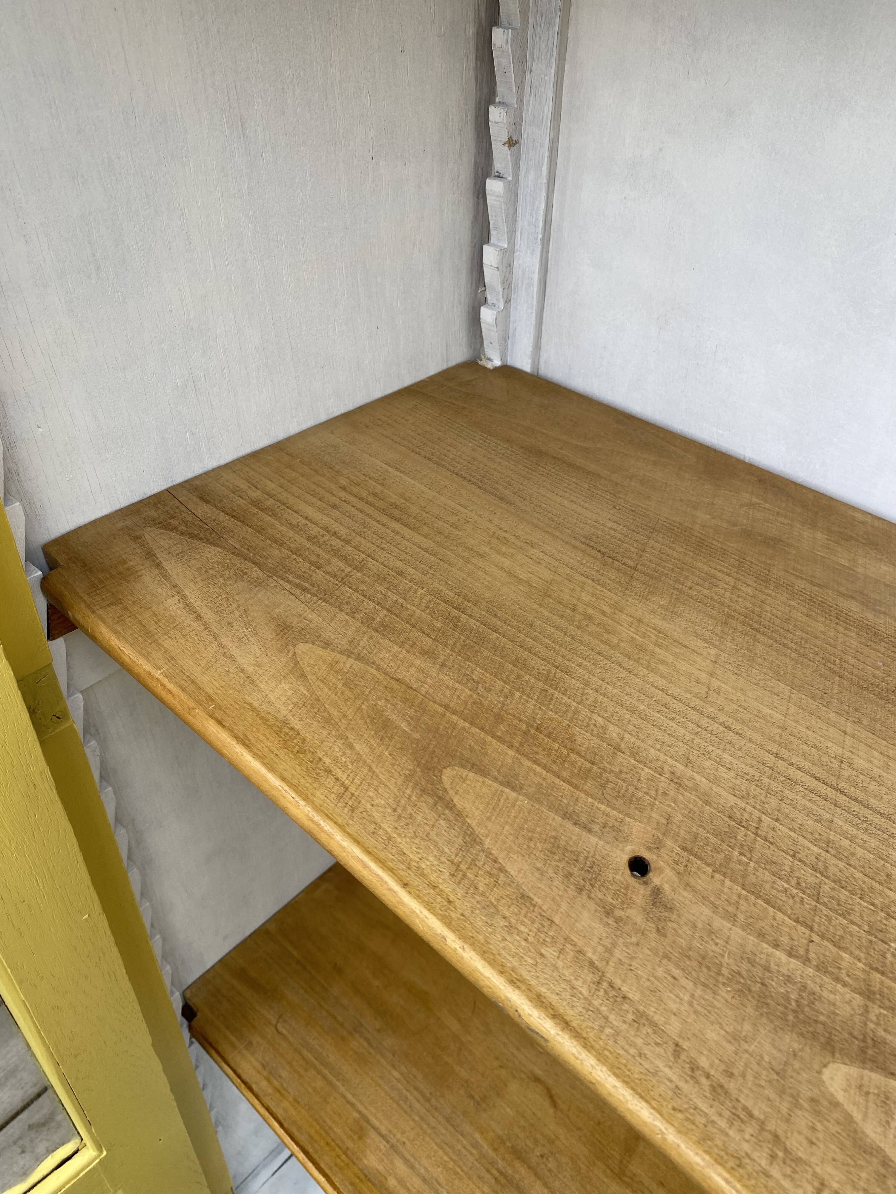 Antique yellow display cabinet