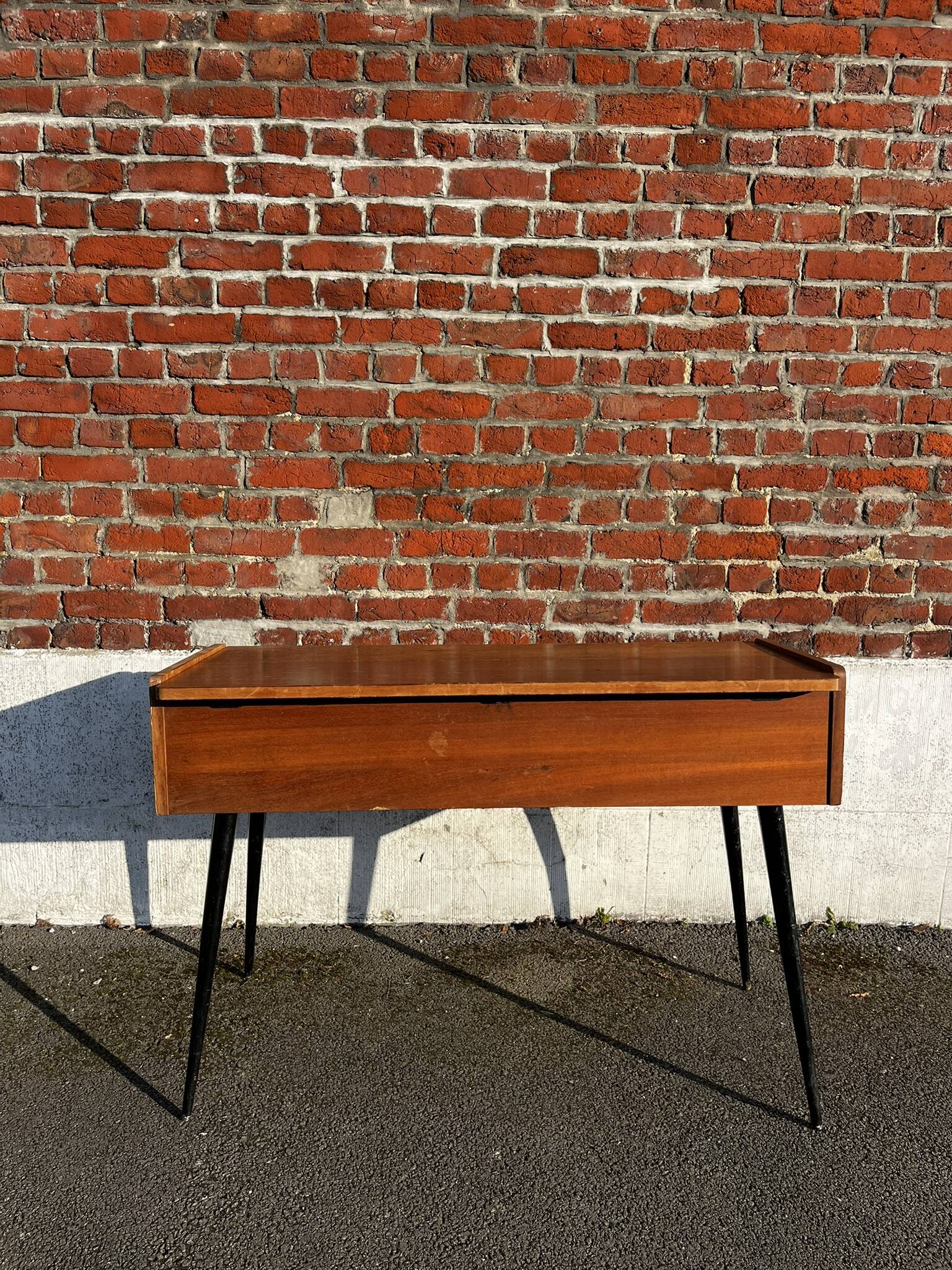 Vintage wooden console/desk with tapered legs.