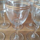 Set of 6 glasses with gold band decorations.