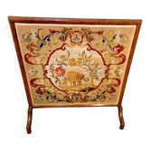 Fireplace screen with wallpaper from the late 19th century.
