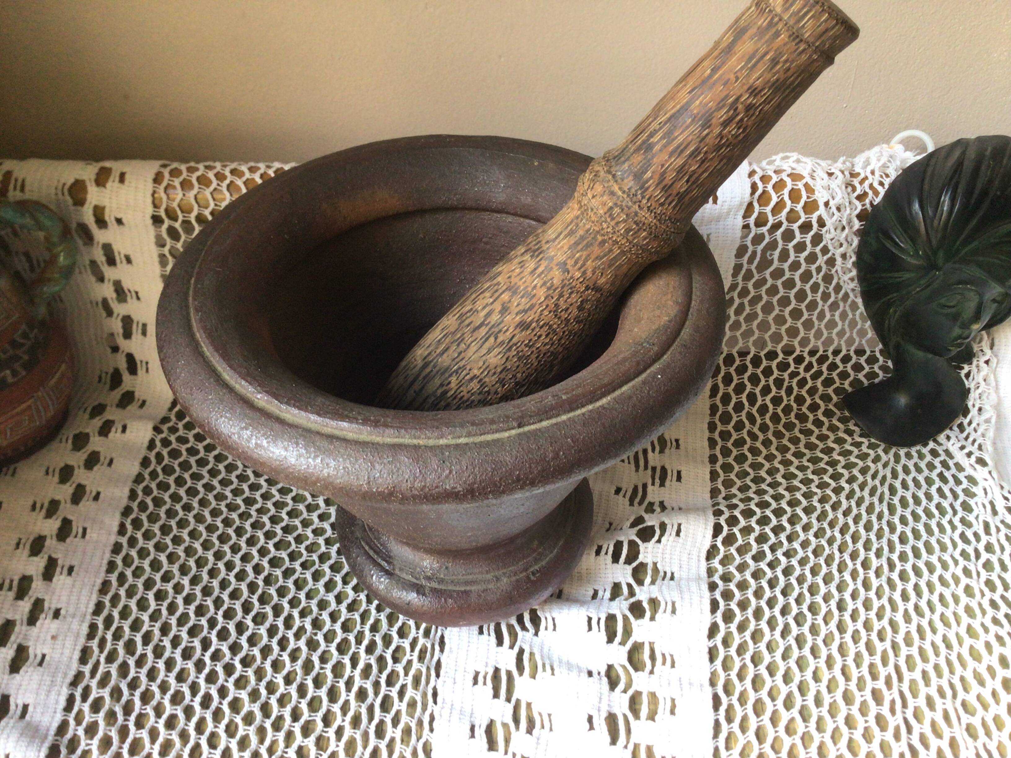 Cast iron mortar and wooden pestle