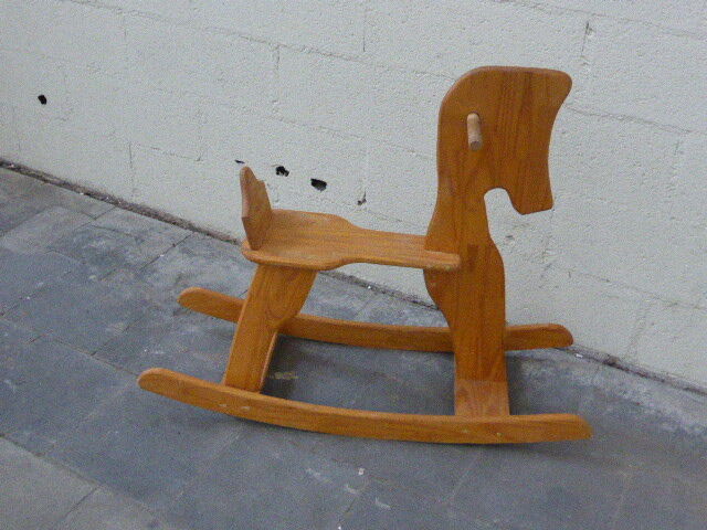 Horse rocking in pine