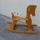 Horse rocking in pine