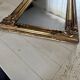 Miroir Louis XV, glace au mercure et bois doré, XIXe