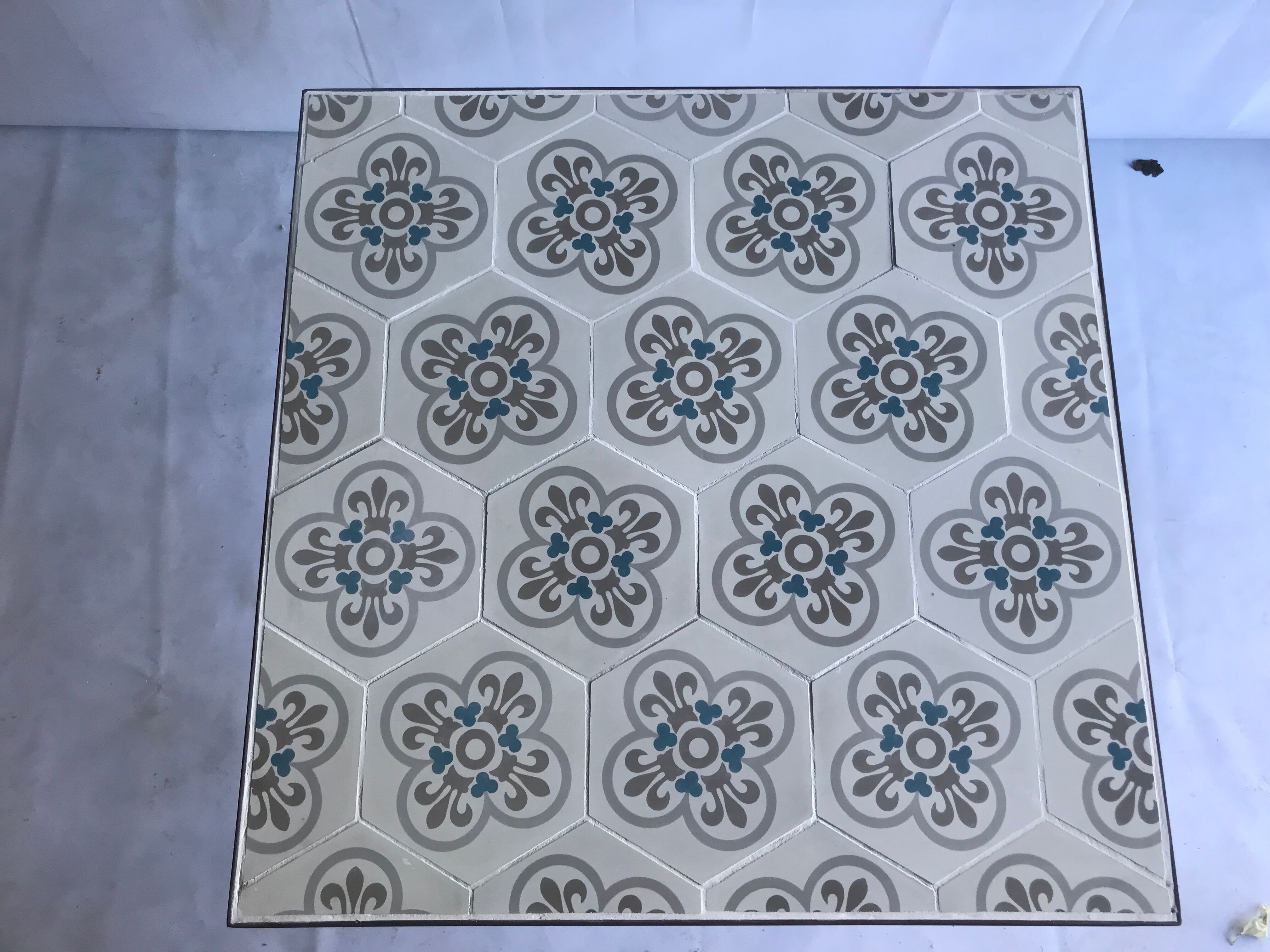 Wrought iron table and cement tile