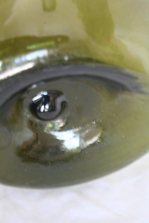 Blown green demijohn