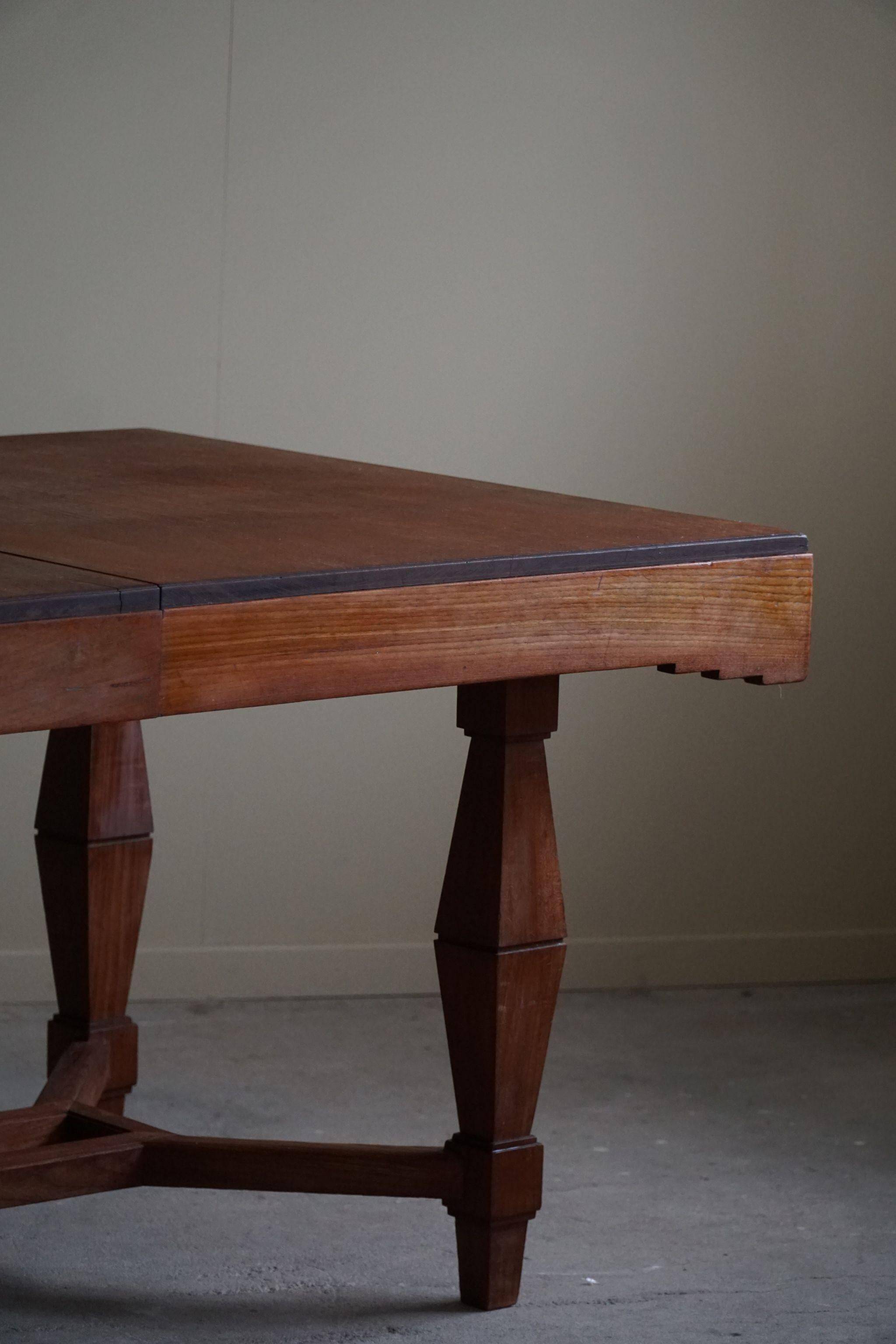 Art Deco dining table in teak, with butterfly extension, Danish cabinetmaker, 1940s.