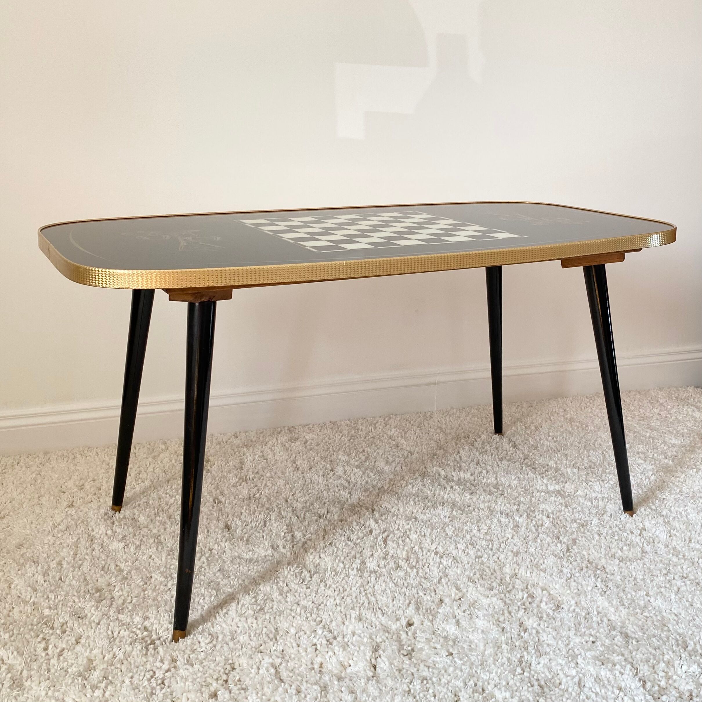Rectangular vintage coffee table in black and gold glass