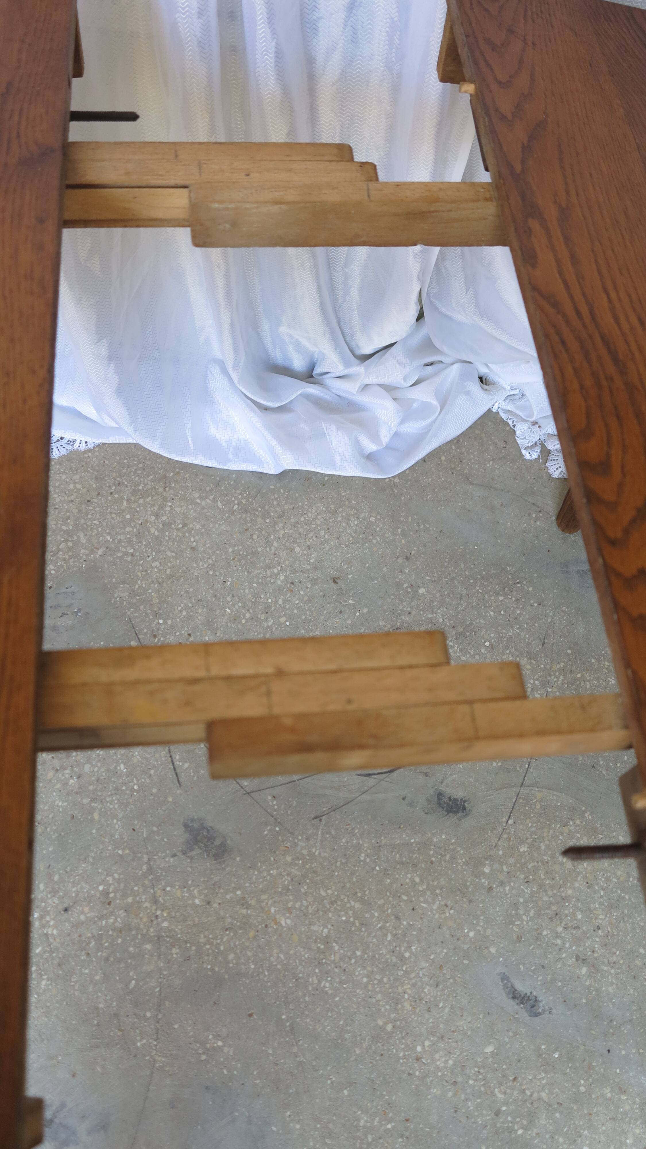 1930s oak dining table, slightly oval.