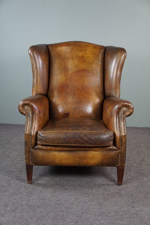 Patinated sheepskin armchair