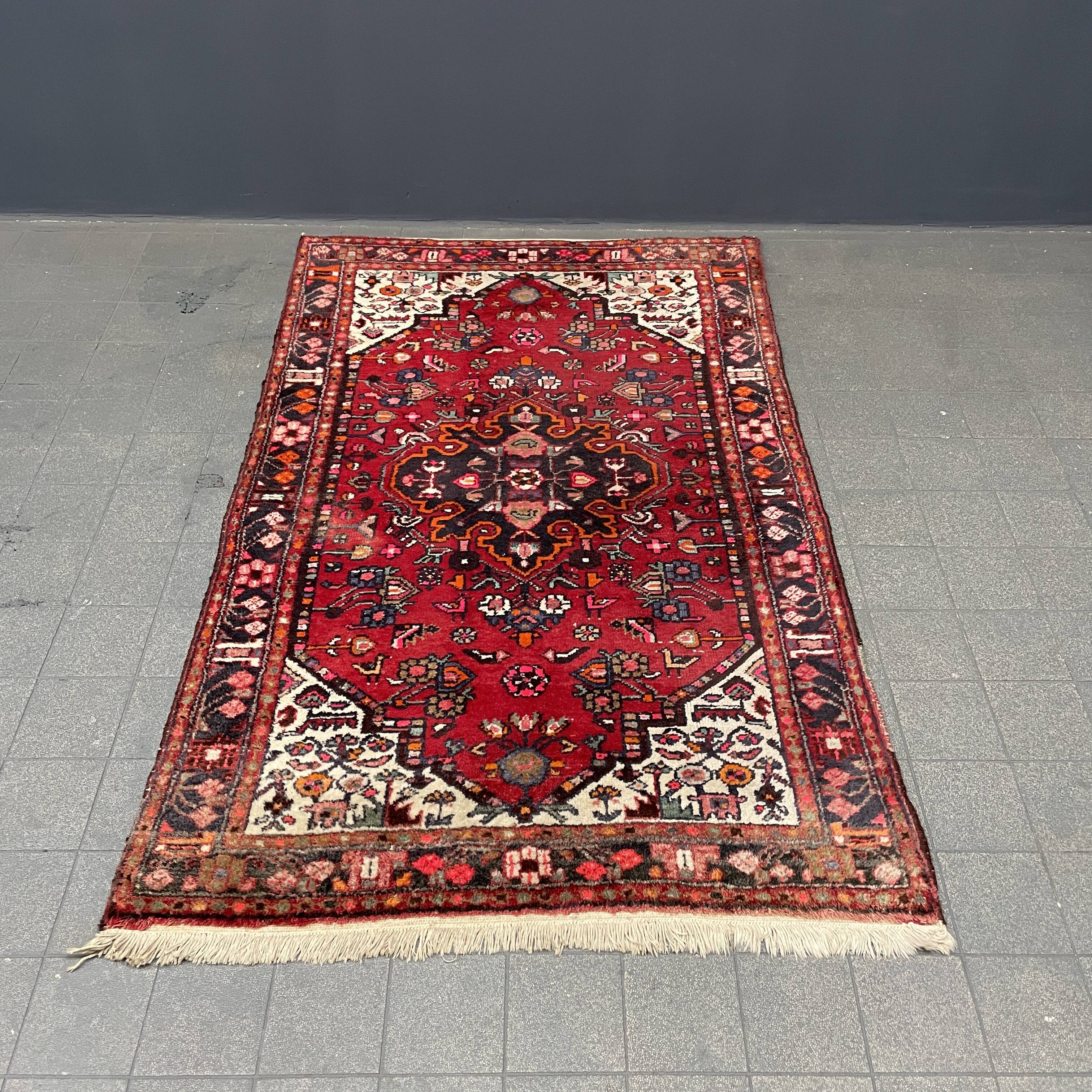 Worn vintage oriental rug or carpet