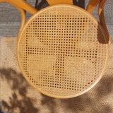 swivel armchair in wood and cane