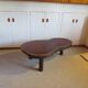 Tripod coffee table - solid okoumé wood - organic shape - brutalist style