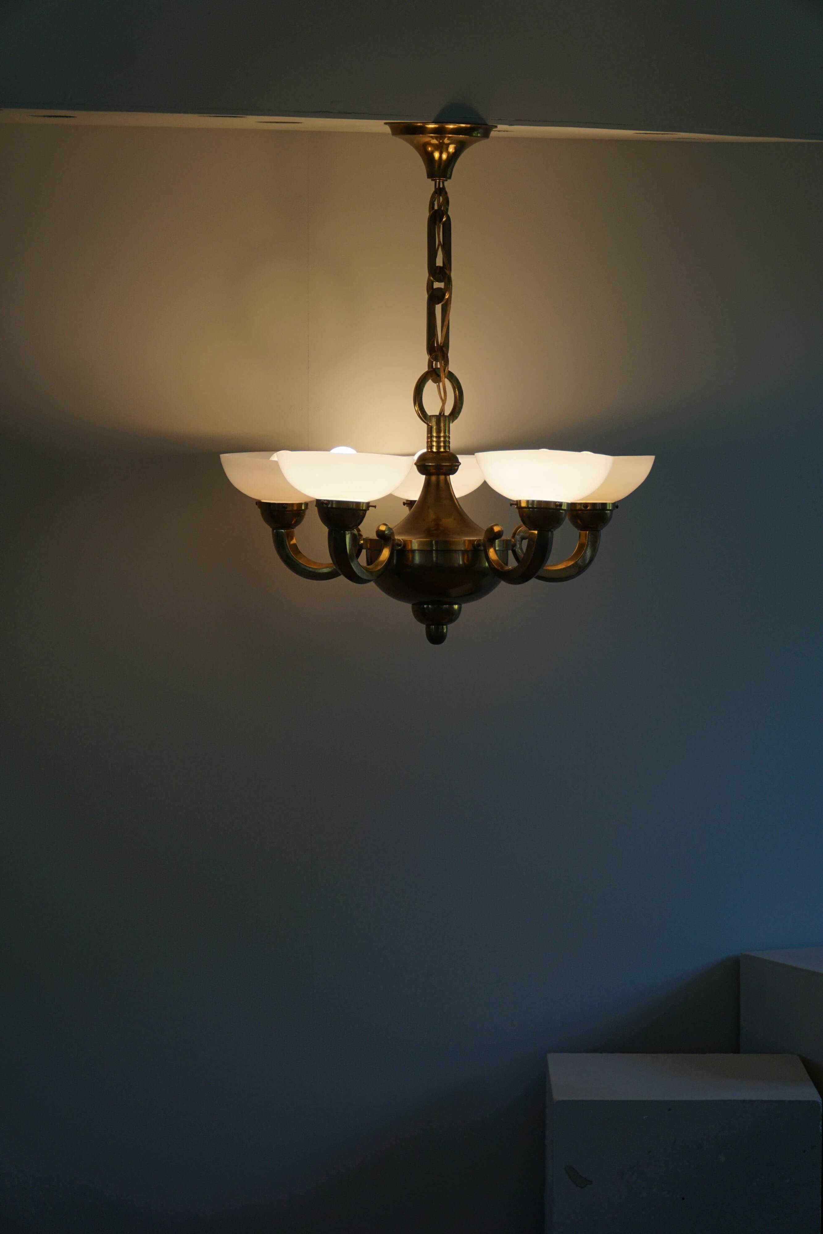 A modern Danish Art Deco chandelier, glass and brass, 1940s.