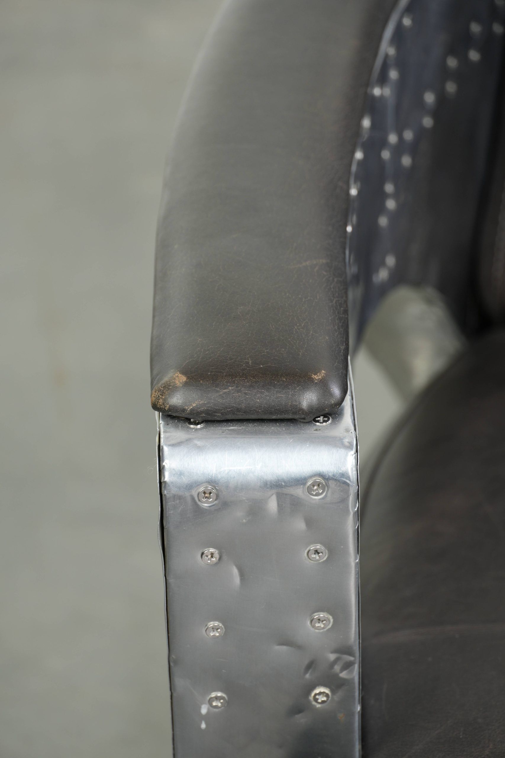 Set of 2 sturdy industrial black cowhide Aviator design armchairs with aluminium and rivets