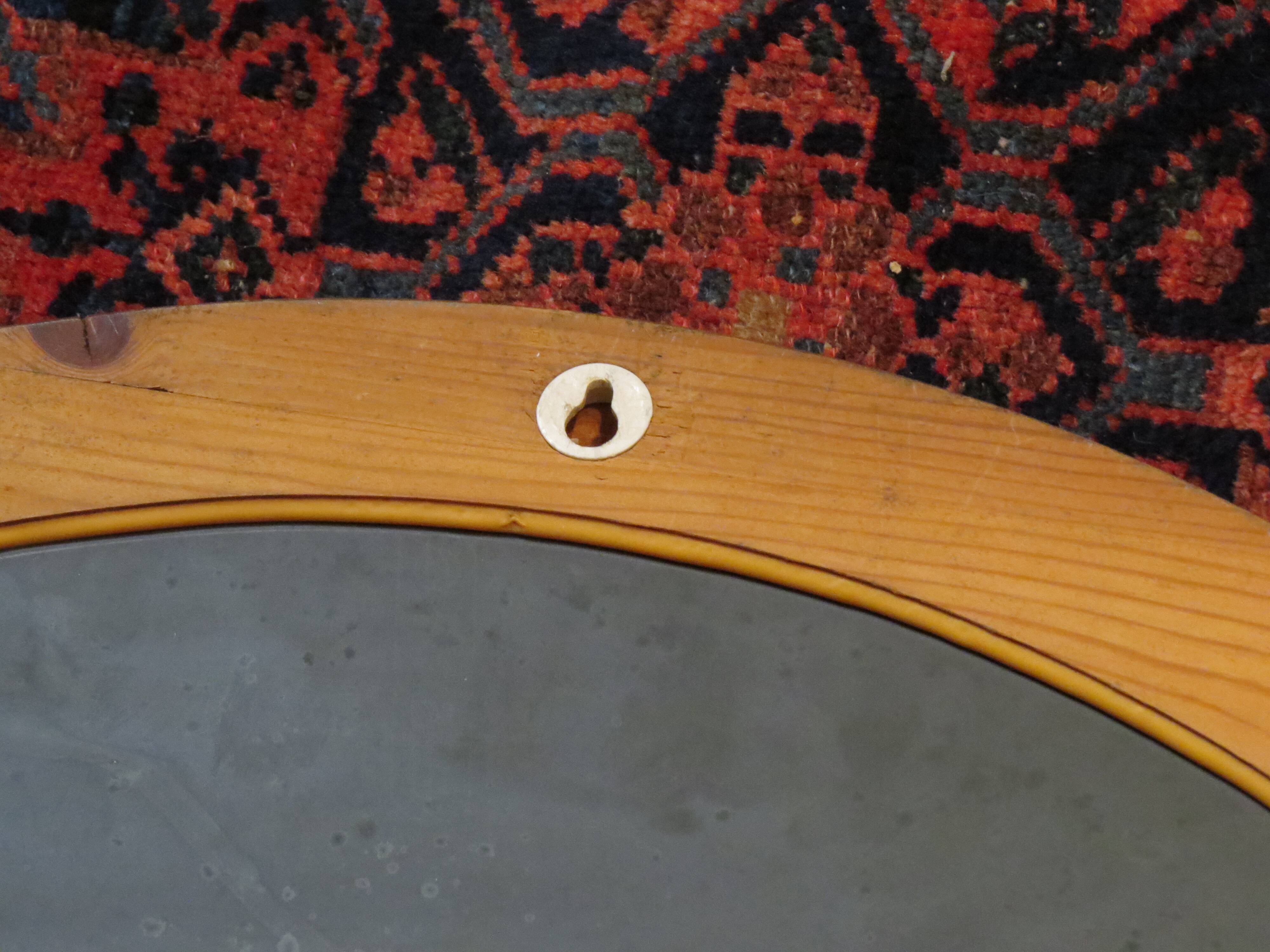 Pair of round Scandinavian pine mirrors from the 70s