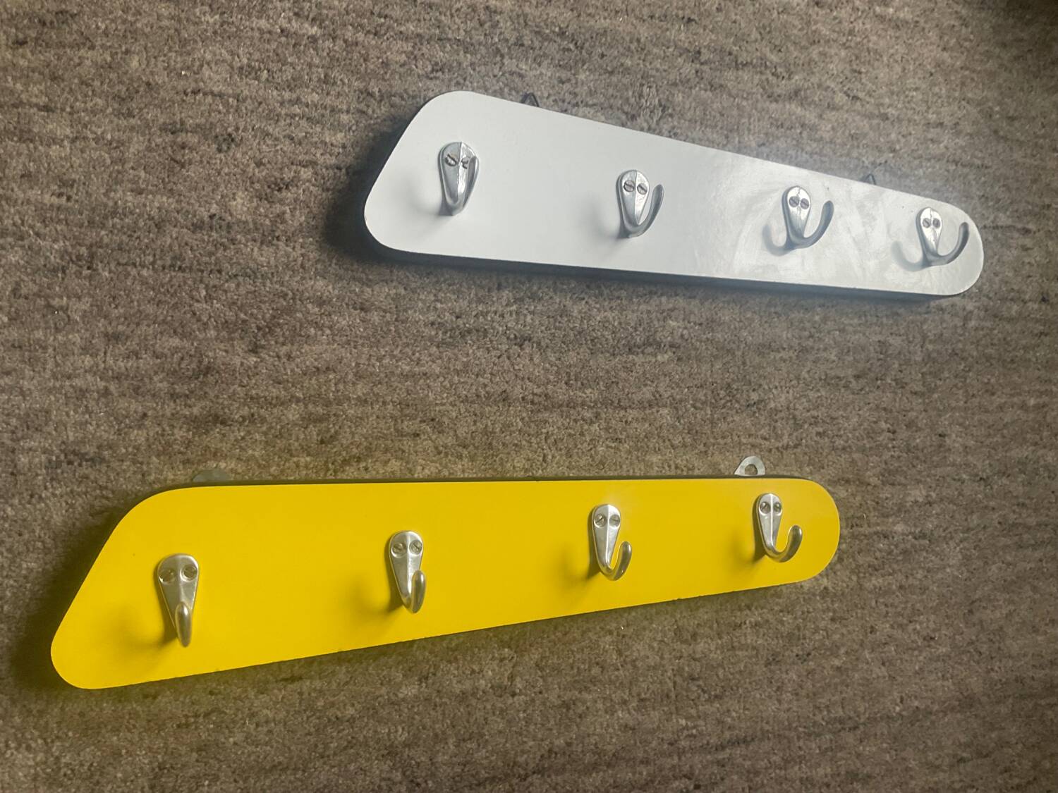 Duo of asymmetrical Formica coat racks from the 60s
